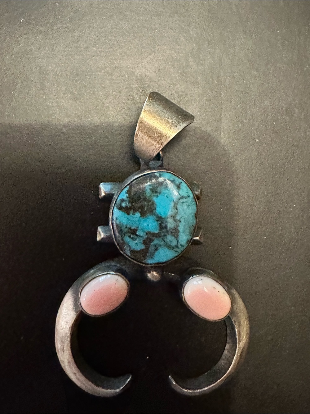 Navajo Sterling Silver Naja Pendant with Turquoise and Pink Coral Cabochons.